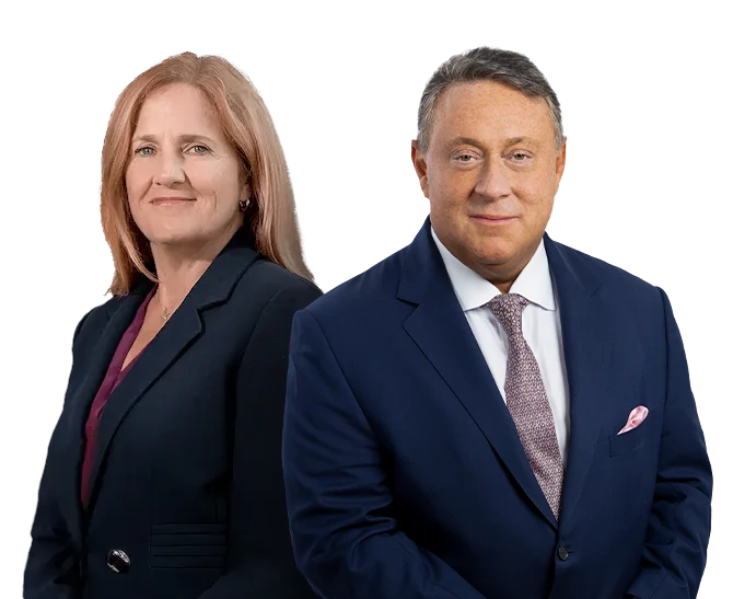 Felice and Andrew standing in a suits